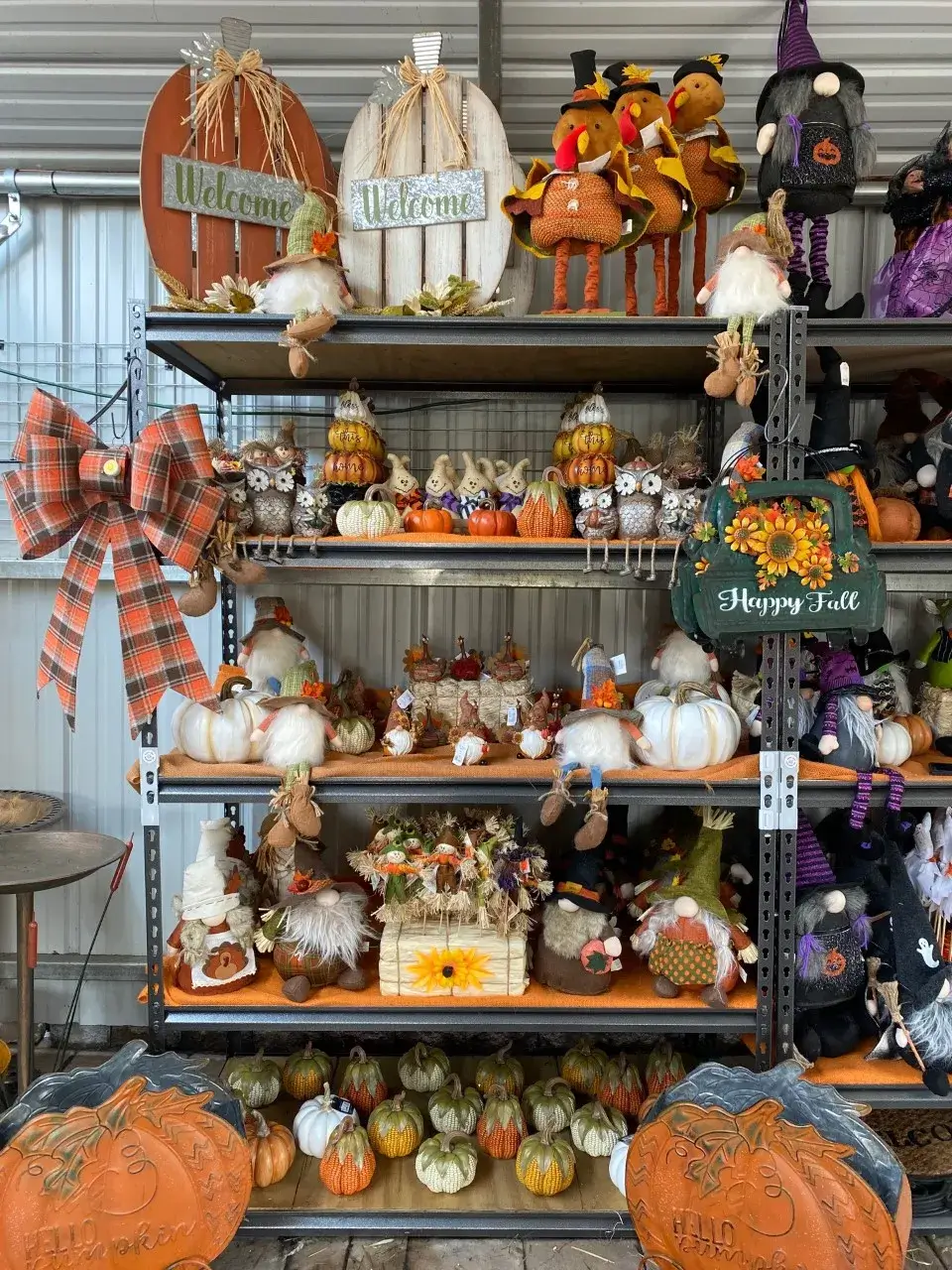 Colorful fall decorations with pumpkins and gnomes display.