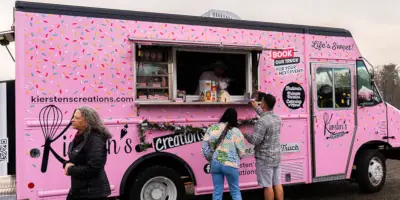 Customers ordering food at Kiersten's Creations Dessert truck.