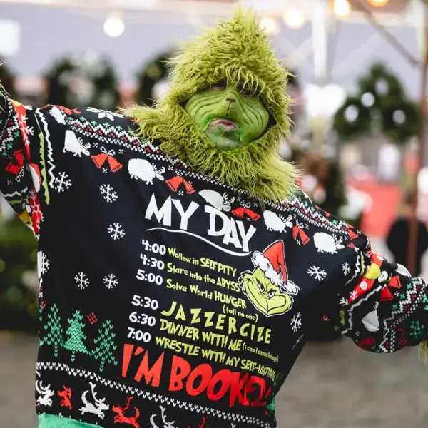 Person Wearing Grinch Costume Christmas Sweater Person in Grinch costume wearing festive sweater.