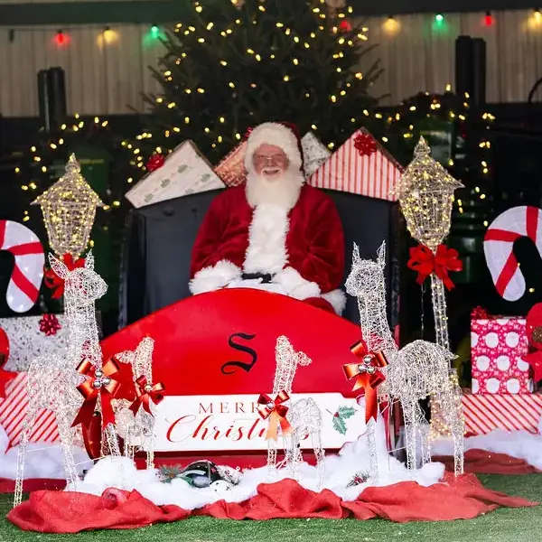 Countryview Farms Nursery Santa Claus Sitting In Sleigh Countryview Farms Nursery's Santa Claus sitting in sleigh surrounded by festive Christmas scenery.