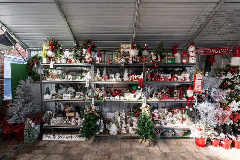 Christmas decorations on display in a festive shop.