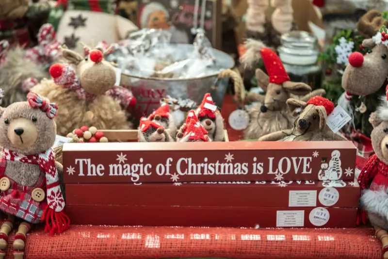 Christmas decorations and toys with festive message.