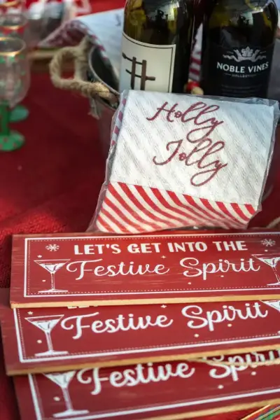Christmas decor with wine and festive signs